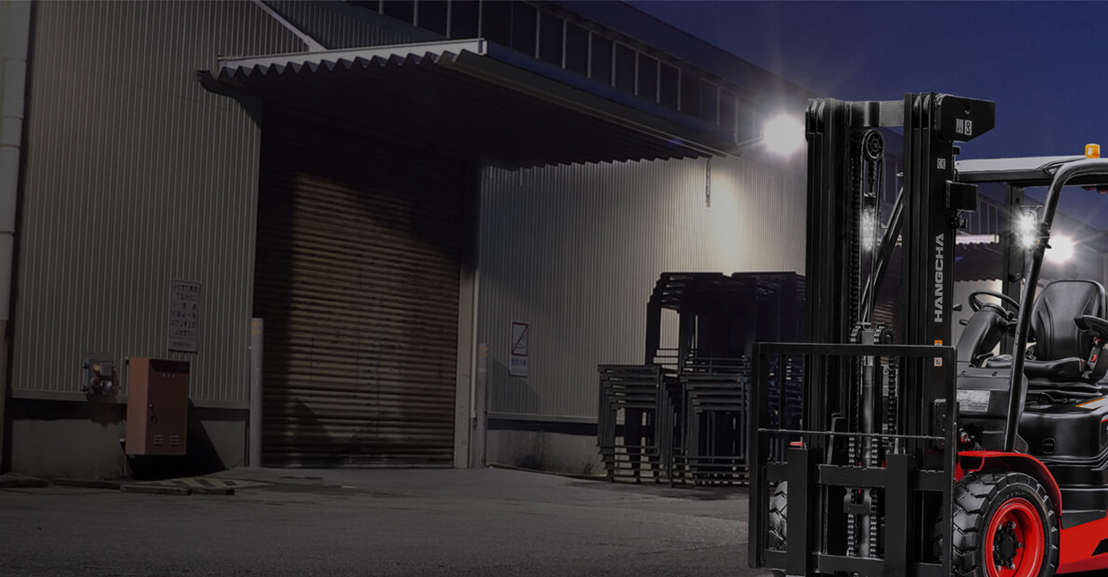 Forklift outside the warehouse in the evening